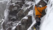 Photograph of climber climbing a snowy slope
