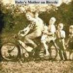 Ruby's mother on a bicycle (she was in her 60's. Also son-in-law Bill Thompson,baby Norman Thompson, Mervyn Thompson, Raymond Thompson (7 years old) and George Purdy (4 years old).