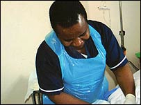 Moses applying sugar to a wound