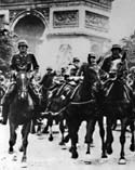 Photograph of German troops riding horses down the Champs D'Elysee in Paris