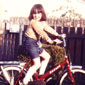 Lisa as a child on her bicycle