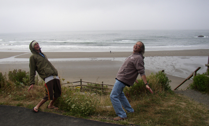 The Work Out. As a 'real' surfer does the stretch thing on the beach below, Finger and Kevan do their own version of a yoga-esque preparation for a session of surfage. Pic: Mekenas Aug 06