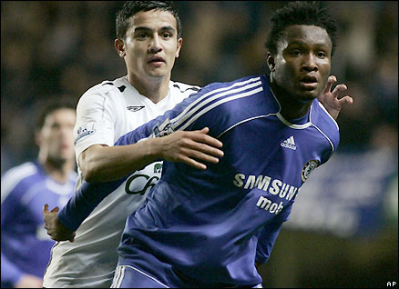 Jon Mikel Obi holds off Everton's Tim Cahill