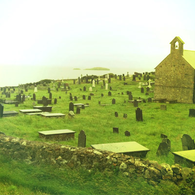 A view over the graveyard towards Middle Mouse island where Saint Patrick was once shipwrecked.