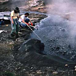 Scientists sampling a hot spring