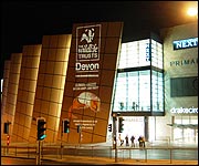 Poster lit up at Drake Circus, Plymouth