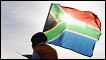 Fans in Kimberley, South Africa wave a South African flag to celebrate the 50 day countdown to the start of the 2010 World Cup