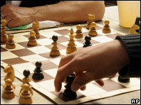 Someone making a chess move