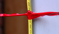 One way to measure the height of canister rockets is to take a tape measure to an outside wall.