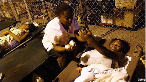 An injured woman is treated at a makeshift hospital in Port-au-Prince, Haiti