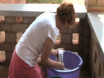 Jan doing her washing in a bucket