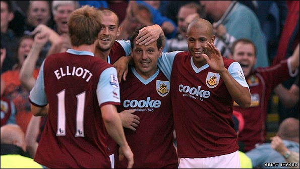 Blake is congratulated by his team-mates after his stunning volley 