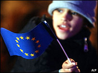 A young girl waves an EU flag