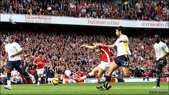 Cesc Fabregas scores Arsenal's second goal against Tottenham