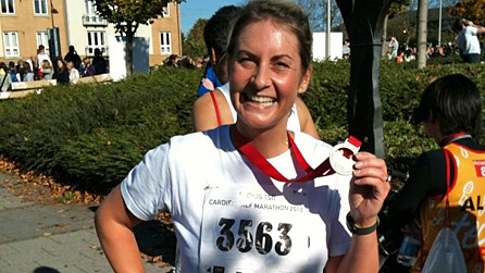 Louise with her medal after running...