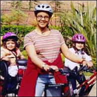 Helen Keplinger biking with 2 daughters