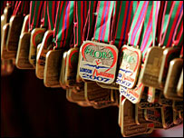  Medals hanging at the finish line await the runners