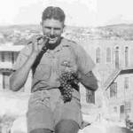 My brother Jack enjoying grapes in Palestine.