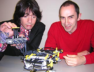 Laurence Llewellyn Bowen and Prof. Chris Wise with a walking building.