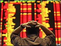 Trader watching shares board