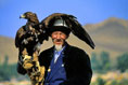 Man holding an eagle, photo by Tom Ang