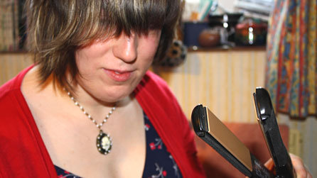 With her fringe done, Nicola removes the straighteners, but doesn't seem very convinced by what's happened to her hair