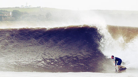 Surfer at Tenby South beach by Adie @ frames photography