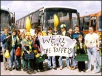 City fans in front of a bus