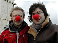 Two people wearing red noses