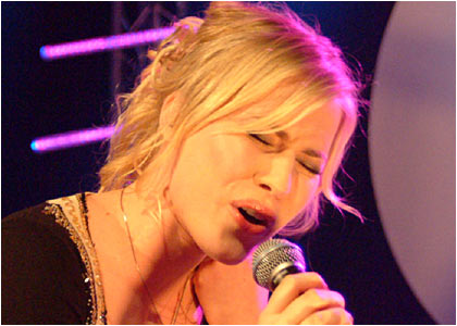 Natasha Bedingfield on stage at the R1 / TOTP Christmas Party