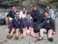Beach cleans / marine litter (young farmers volunteering to help the Trust clean one of its beaches) by NT 
