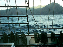 Sailing past an island