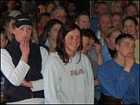 Trainers watch the race