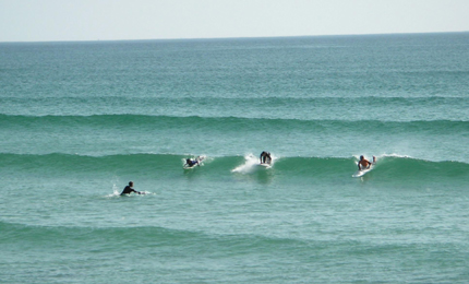 Shared take off- no such thing as priority at the clean glassy swell of Penhors beach, Brittany, August 2006 . Pic: David Gibson