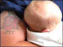 father with Bradford City tattoo and baby