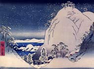 Snowy hilltop with roofs of shrines visible