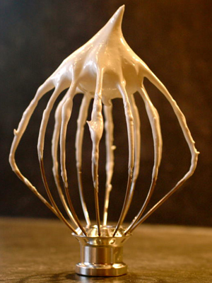 Meringue mixture on a whisk