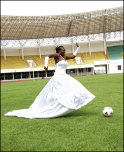 A bride shows off her football skills at the Tamale sports stadium