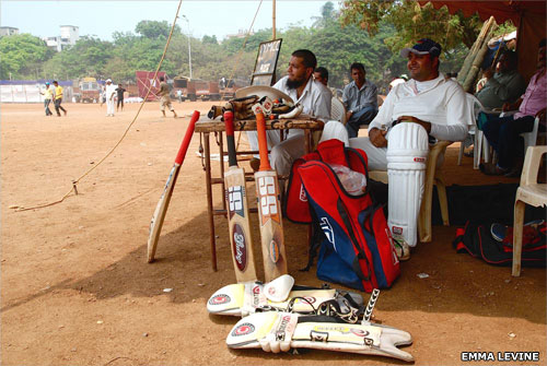 Men waiting to bat in cricket game