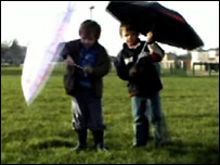 Children with umbrellas