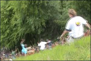 People cheese rolling