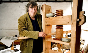 Stephen Fry And The Gutenberg Press: Stephen Fry with replica press