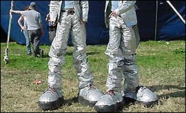 The bottom half of two punk stilt walkers