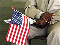 An African man awaits a US citizenship ceremony