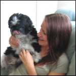 Toni chills out on the sofa with her dog
