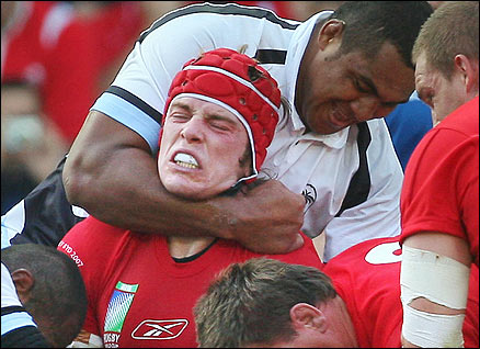 Wales's lock Alun-Wyn Jones (L) vies with Fiji's flanker Semisi Naevo