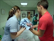 Ashton's dad hands him over to the theatre nurse