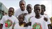 Didier Drogba with children in Abidjan