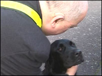 A man and his guidedog on their walk