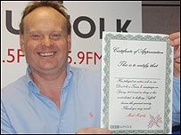 Mark Murphy with a litter angel certificate